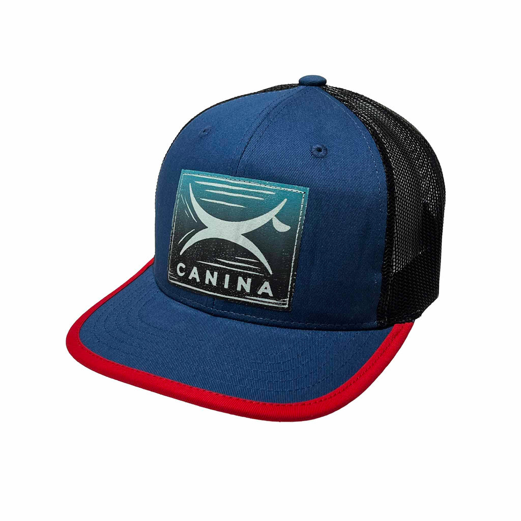 Canina x Recaps cotton trucker hat in blue and black with block print logo
