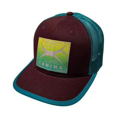 Canina x Recaps cotton trucker hat in maroon and teal with block print logo